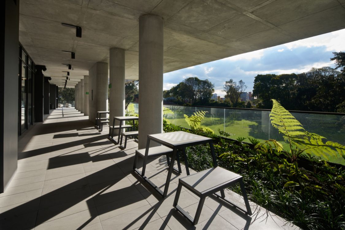 Gimnasio Moderno School Coliseum - Covered concrete walkway and seating area overlooking school athletic fields - Felipe Gonzalez Pacheco.jpg